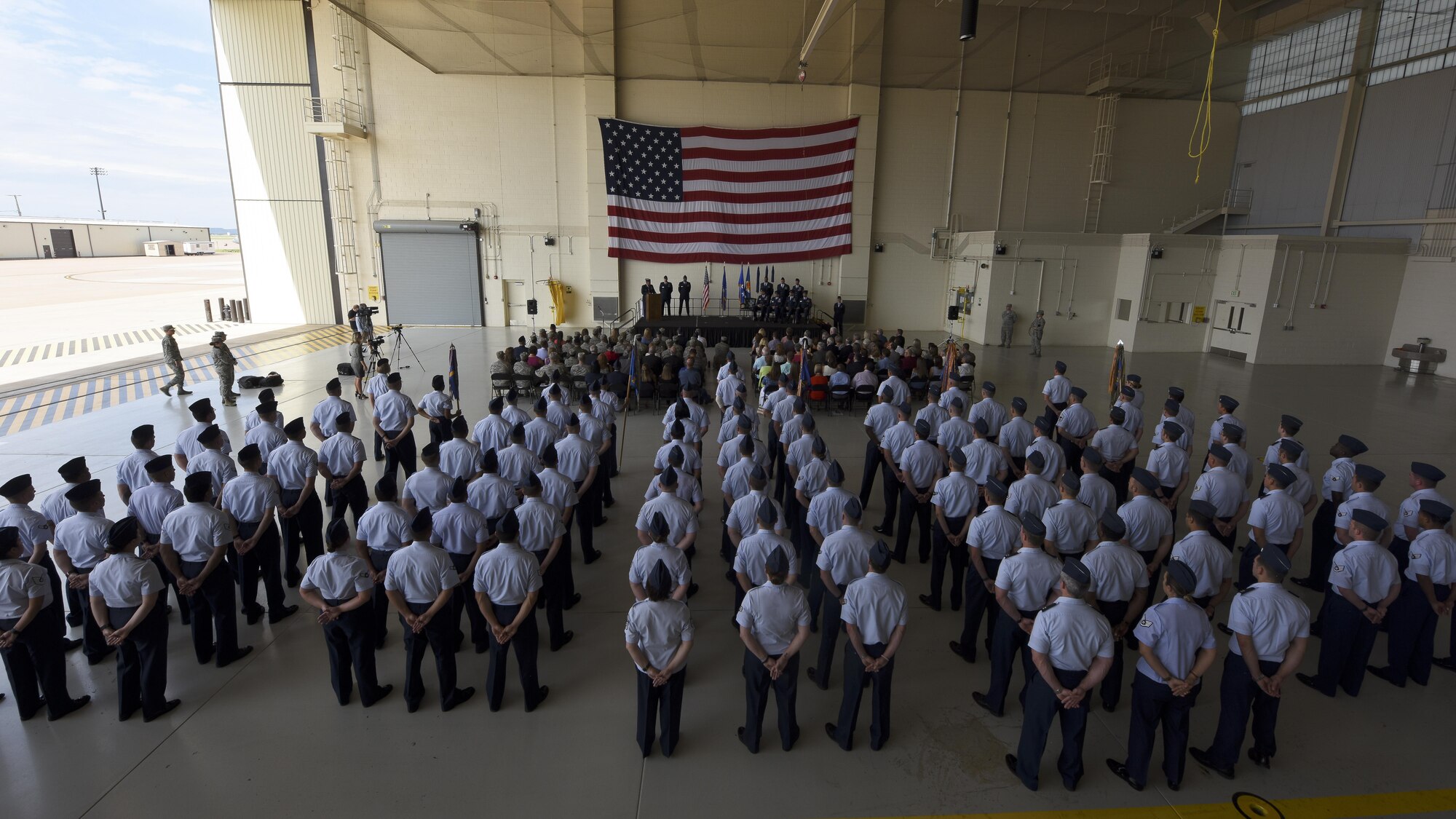 U.S. Air Force Airmen assigned to the 317th Airlift Group stand in formation during the 317th Airlift Wing activation ceremony at Dyess Air Force Base, Texas, July 6, 2017. In addition to Team Dyess members, civic leaders, community partners, distinguished guests and family members attended the deactivation of the 317th AG and activation of the 317th AW. (U.S. Air Force photo by Senior Airman Kedesha Pennant)