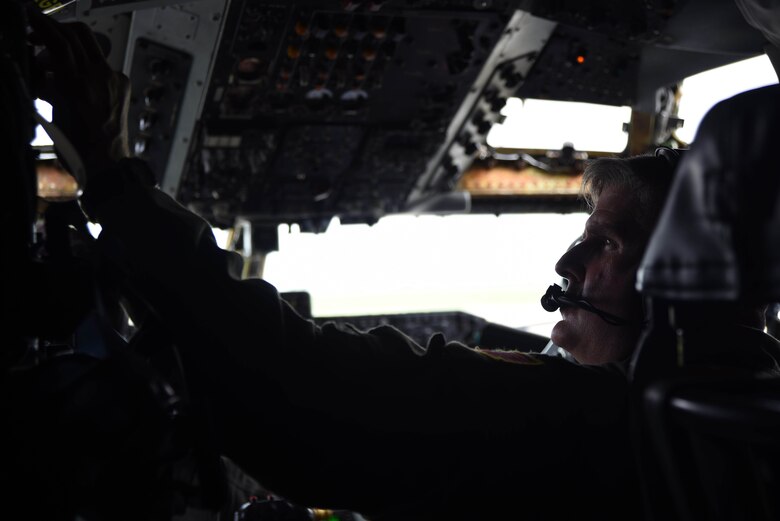 Col. Albert Miller, 22nd Air Refueling Wing commander, changes frequencies on a radio during his fini-flight, June 30, 2017, above Missouri. The fini-flight is a time-honored military aviation tradition marking the last flight of a pilot’s time with a unit. (U.S. Air Force photo/Airman 1st Class Alan Ricker)