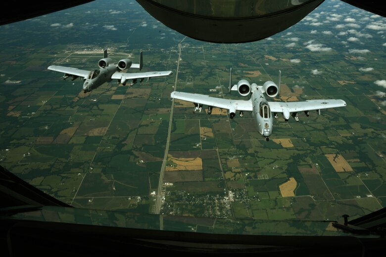 Two A-10 Thunderbolt IIs assigned to Whiteman Air Force Base, Mo., fly in formation after being refueled by a KC-135 Stratotanker assigned to McConnell Air Force Base, Kan., June 30, 2017, over Missouri.  The A-10 is designed for close air support of ground forces. (U.S. Air Force photo/Airman 1st Class Alan Ricker)