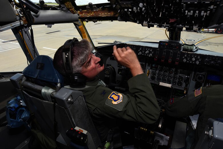 Col. Albert Miller, 22nd Air Refueling Wing commander, operates a control panel after landing a KC-135 Stratotanker, June 30, 2017, at McConnell Air Force Base, Kan. Miller was greeted and hosed down with water by his family and friends upon completion of his fini-flight. (U.S. Air Force photo/Airman 1st Class Alan Ricker)