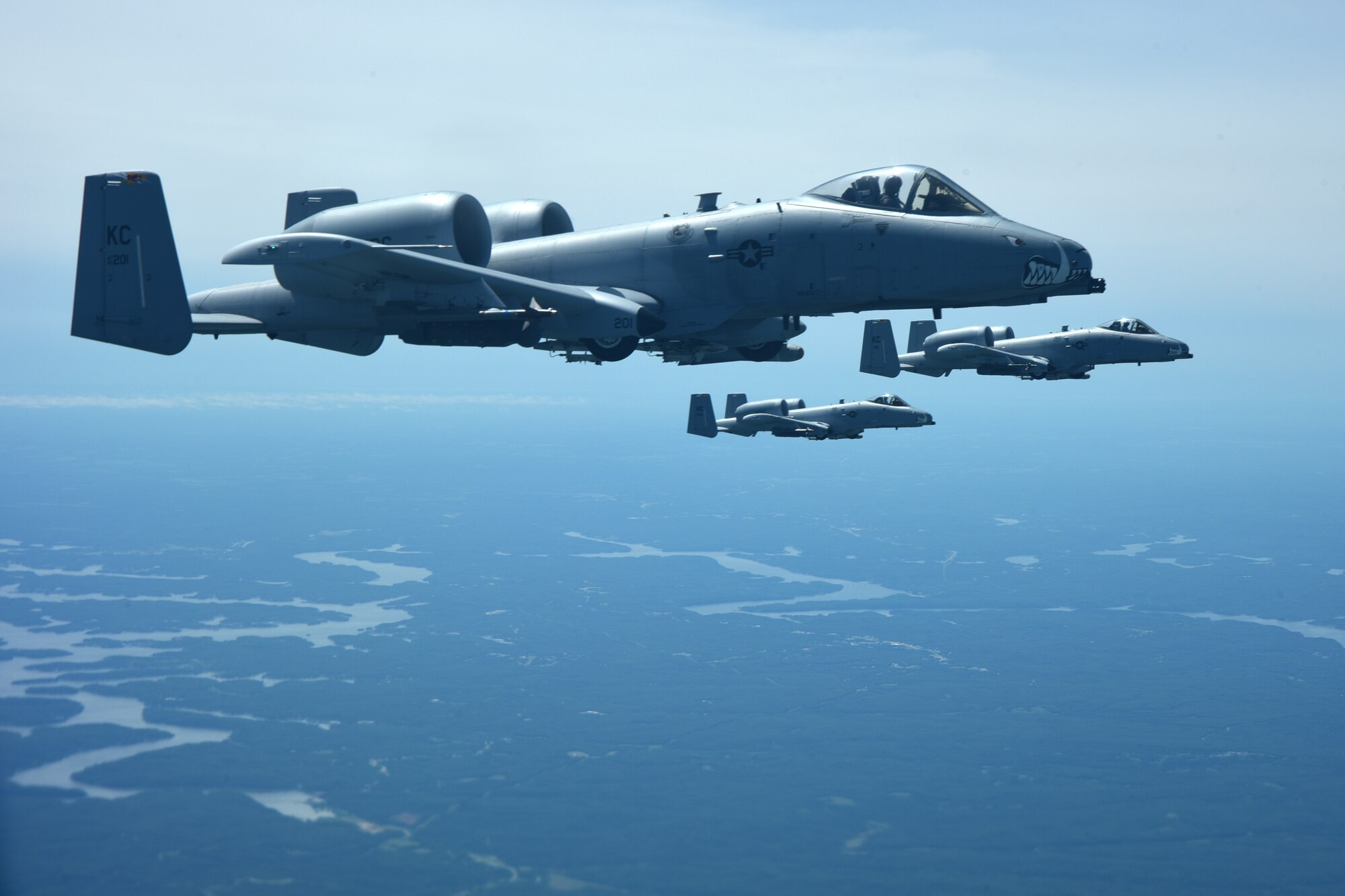 Three A-10 Thunderbolt II’s, assigned to Whiteman Air Force Base, Mo., fly alongside of a KC-135 Stratotanker after refueling, June 30, 2017. A-10’s provide close air support to warfighters on the ground but require refueling mid-flight due to its limited range. (U.S. Air Force photo/Senior Airman Chris Thornbury)