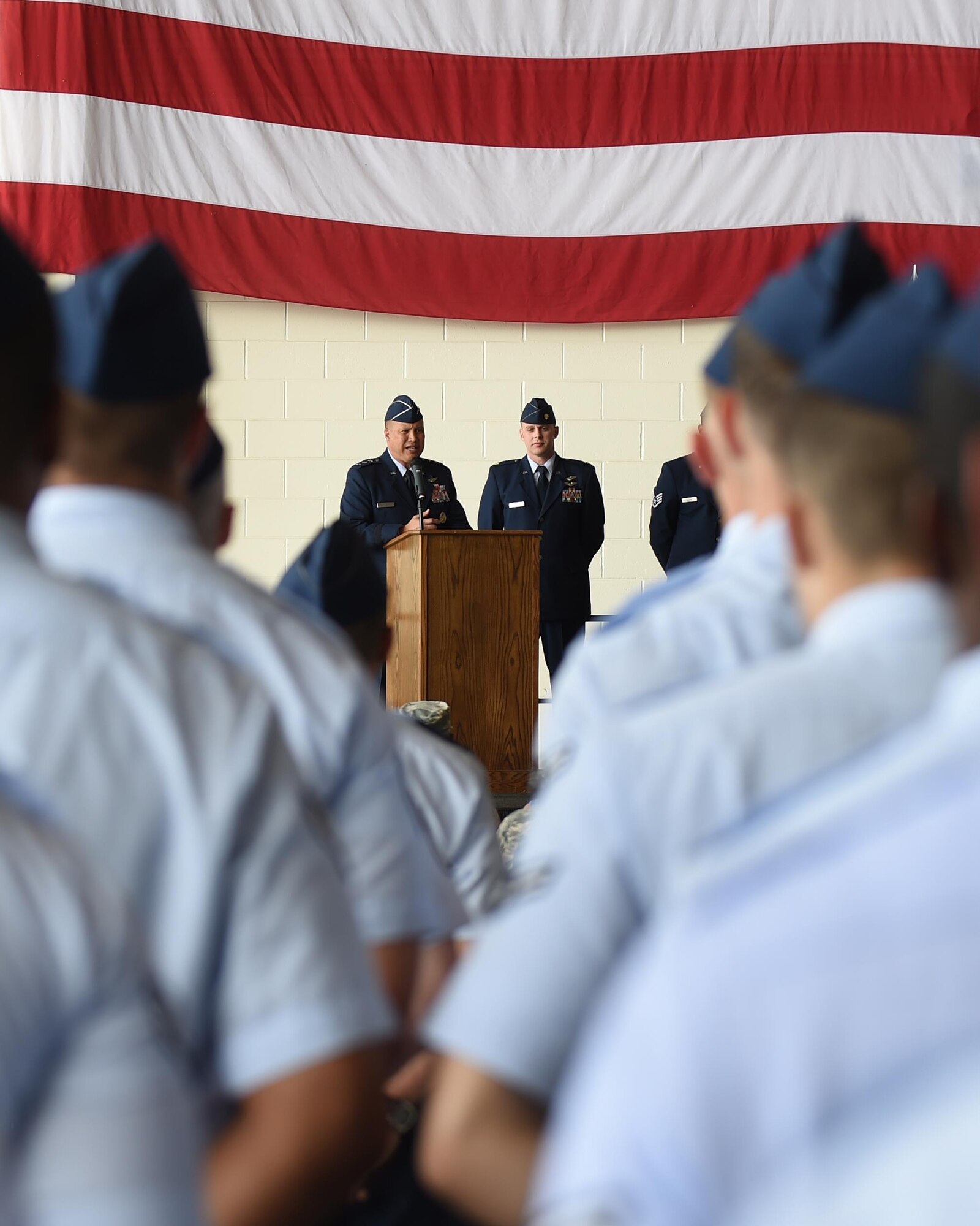 U.S. Air Force Maj. Gen. Giovanni Tuck, 18th Air Force commander, addresses the attendees at the 317th Airlift Wing activation ceremony at Dyess Air Force Base, Texas, July 6, 2017. Tuck presided over the ceremony that deactivated the 317th Airlift Group and reactivated it as the 317th Airlift Wing. The 317th Operation Support Group and 317th Maintenance Group were also activated as part of the wing. (U.S. Air Force photo by Senior Airman Alexander Guerrero)