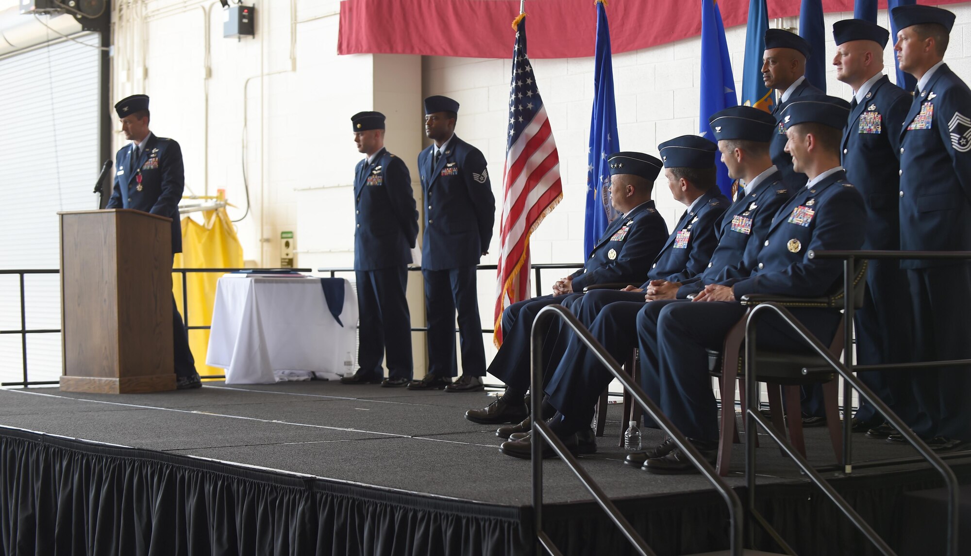 U.S. Air Force Col. Stephen Hodge, 317th Airlift Group commander, speaks to Dyess Airmen, family members and civic leaders at Dyess Air Force Base, Texas, July 6, 2017. Hodge was awarded the Legion of Merit for his contributions and accomplishments while commanding the 317th AG and then relinquished command to Col. David Owens. (U.S. Air Force photo by Senior Airman Alexander Guerrero) 