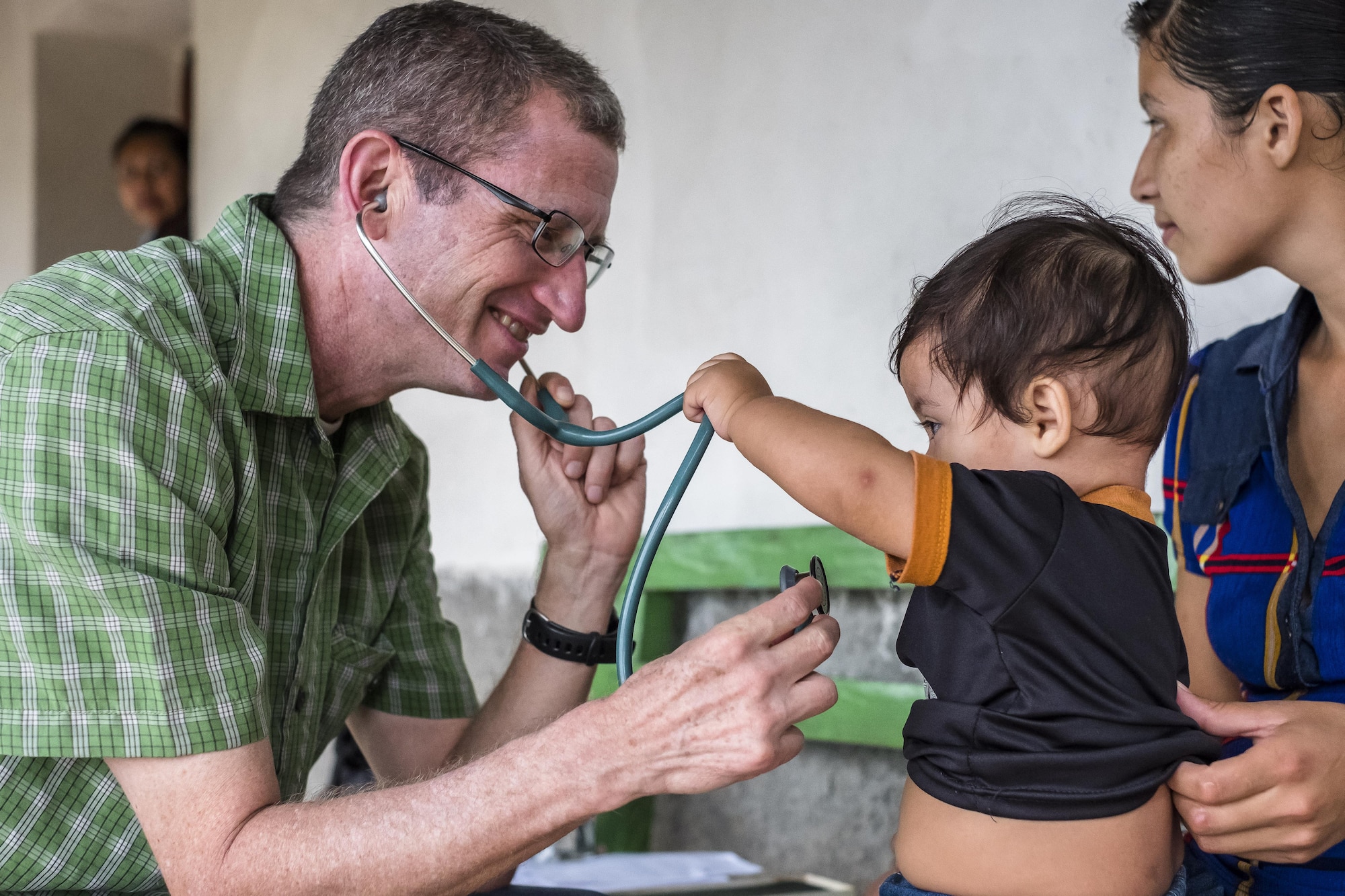 U.S. Army COL Douglas Lougee performs a physical assessment on a child during a pediatric nutritional assessment mission. Joint Task Force – Bravo Medical Element personnel participated in a pediatric nutritional assessment mission as members of a joint team with the Honduran Ministry of Health to assess the nutritional status of children from the ages of 6 months to 60 months in the San Antonio area of La Paz, Honduras, Jun 14 - 15, 2017. 