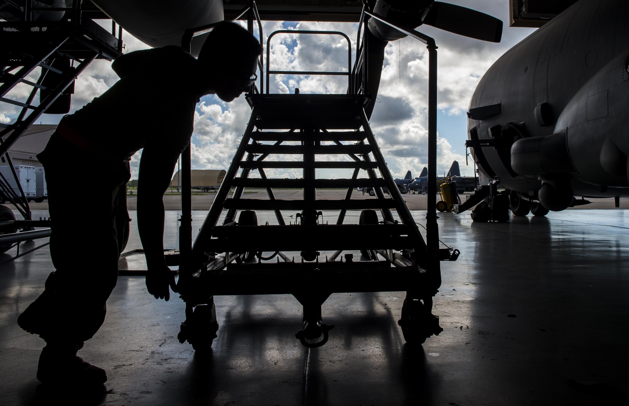 Airman 1st Class James Gaona, an aerospace propulsion journeyman with the 1st Special Operations Aircraft Maintenance Squadron, prepares a stand before conducting maintenance on an AC-130U Spooky gunship at Hurlburt Field, Fla., July 6, 2017. Aerospace propulsion technicians test, maintain and repair AC-130U engines, preparing them to execute the mission any time, any place. (U.S. Air Force photo by Airman 1st Class Joseph Pick)