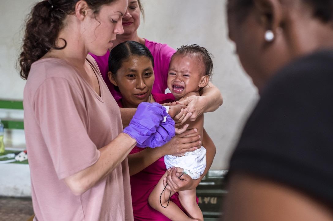 U.S. Army SGT Lacie Thompson performs hemoglobin test to determine the values on a child during a pediatric nutritional assessment mission. Joint Task Force – Bravo Medical Element personnel participated in a pediatric nutritional assessment mission as members of a joint team with the Honduran Ministry of Health to assess the nutritional status of children from the ages of 6 months to 60 months in the San Antonio area of La Paz, Honduras, Jun 14 - 15, 2017. 