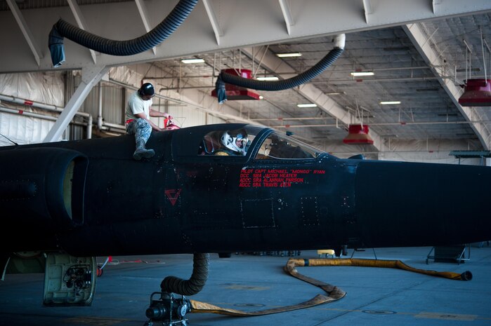 SrA Howard Reyes, 9th Aircraft Maintenance Squadron avionics, removes the upper cooling hose off of a U-2 Dragon Lady that has been prepped for a high altitude flight at Beale Air Force Base, Calif., June 20, 2017. U-2s are home based at the 9th Reconnaissance Wing at Beale AFB Calif., but are rotated to operational detachments worldwide.(U.S. Air Force photo by Airman 1st Class Justin Parsons/released)



