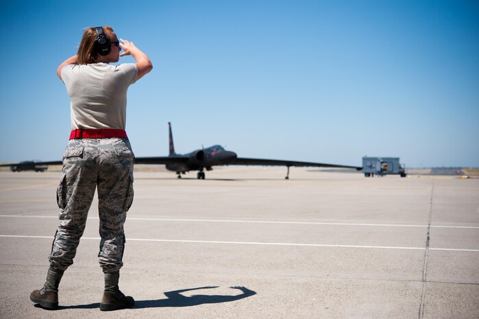 Airman 1st Class Dedrie Flowers, 9th Air Maintenance Squadron crew chief, marshals in a U-2 Dragon Lady for aircraft recovery at Beale Air Force Base, Calif., June 20, 2017. While on the ground, U-2 pilots rely on their chase car to guide and correct their direction.

