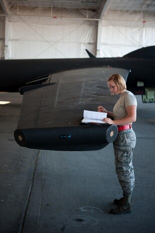 Airman 1st Class Dedrie Flowers, 9th Air Maintenance Squadron crew chief, reviews aircraft forms for serviceability during preparations for a high altitude flight at Beale Air Force Base, Calif., June 20, 2017. Crew chiefs are responsible for ensuring that the squadrons U-2’s are mechanically ready for scheduled missions. (U.S. Air Force photo by Airman 1st Class Justin Parsons/released)
