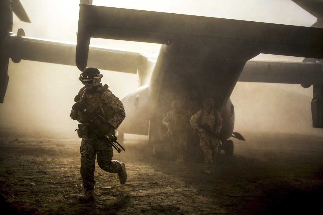 Marines exit an MV-22B Osprey aircraft during assault training at Sierra Del Retan, Spain, June 27, 2017. The Marines conducted limited crisis response and theater security operations in Europe and North Africa. Marine Corps photo by Cpl. Jodson B. Graves
