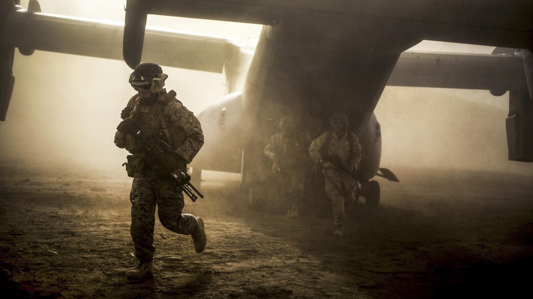 Marines exit an MV-22B Osprey aircraft during assault training at Sierra Del Retan, Spain, June 27, 2017. The Marines conducted limited crisis response and theater security operations in Europe and North Africa. Marine Corps photo by Cpl. Jodson B. Graves