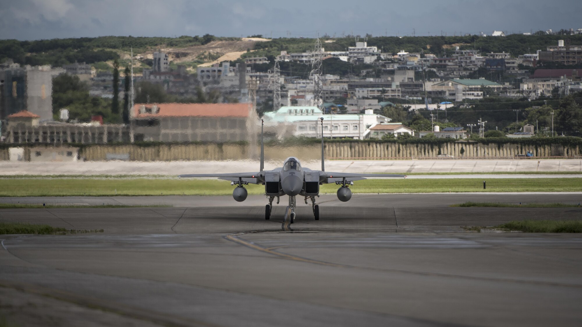 U.S. Air Force Brig. Gen. Barry Cornish, 18th Wing commander, taxis an F-15 Eagle from the 67th Fighter Squadron back to the hanger June 29, 2017, at Kadena Air Base, Japan. Cornish conducted his final flight as the 18th WG commander, a tradition carried out Air Force Base commanders. U.S. Air Force photo/ Airman 1st Class Greg Erwin)