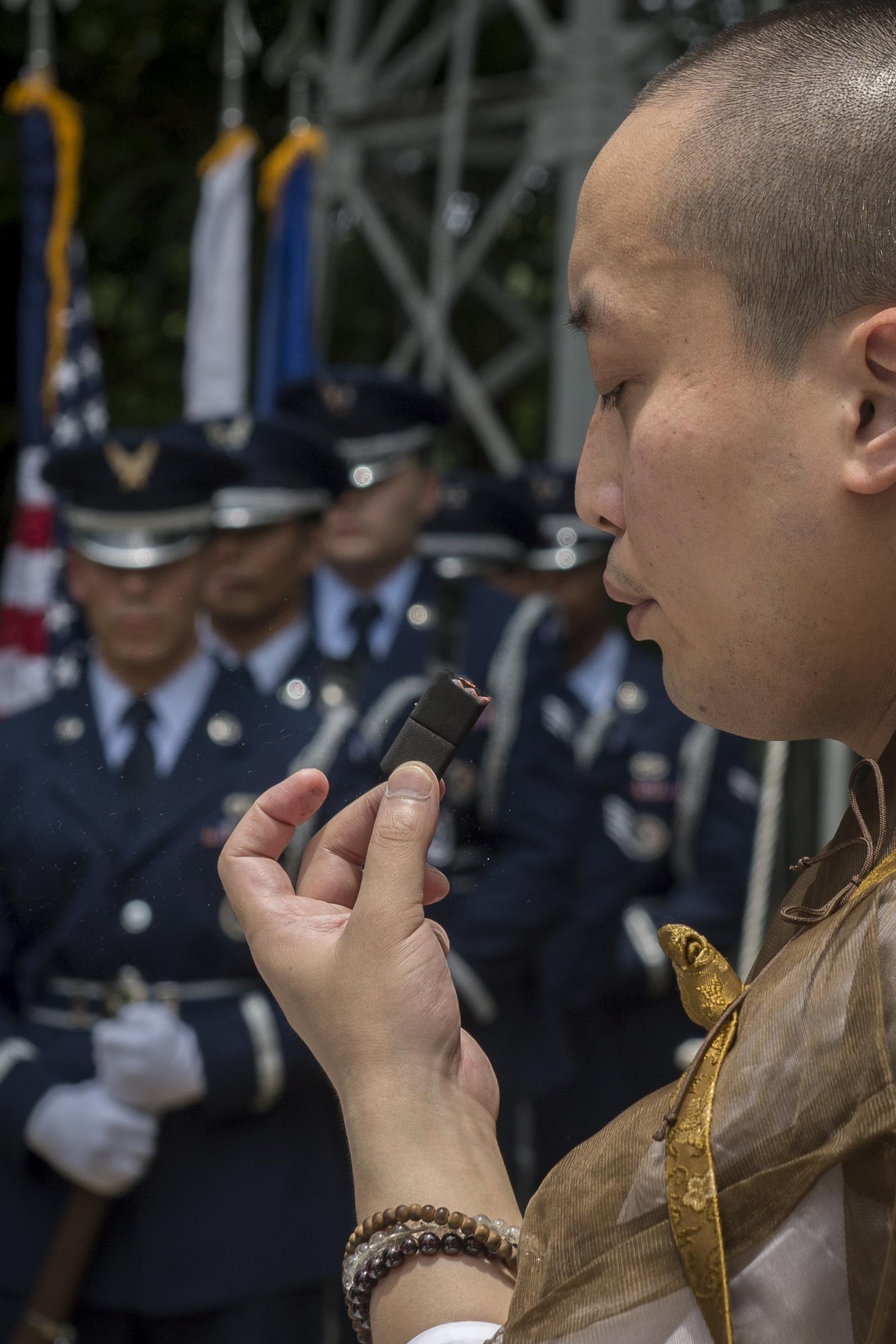 A Buddhist monk makes initial preparations for a B-29 Memorial Ceremony, June 24, 2017, at Shizuoka City, Japan. During the ceremony; flowers, incense and prayers were offered to the American B-29 aircrew and Japanese civilian lives lost. (U.S. Air Force photo by Airman 1st Class Juan Torres)