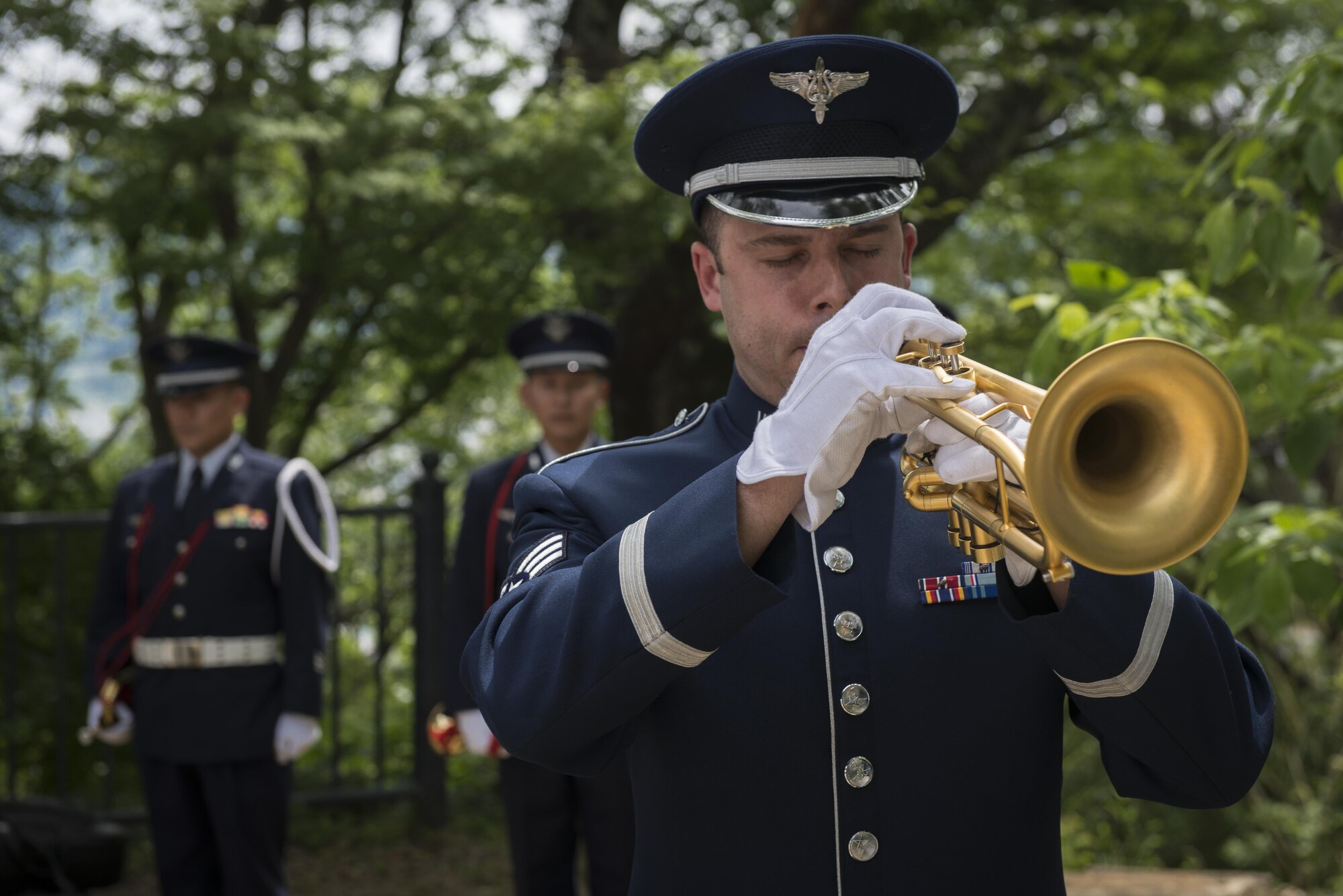 Senior Airman Benjamin Paille, U.S. Air Force Band of the Pacific trumpet player, plays Taps during a B-29 Memorial Ceremony, June 24, 2017, at Shizuoka City, Japan. Since 1972, Yokota Air Base Airmen have volunteered their time to take part in a US-Japan joint memorial service to pay respect to those who lost their lives on June 19, 1945, during a World War II air raid over Shizuoka. (U.S. Air Force photo by Airman 1st Class Juan Torres)