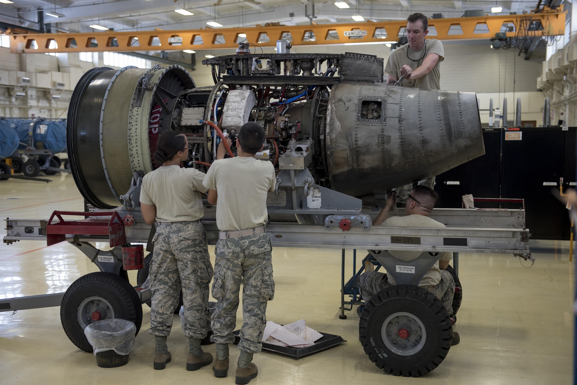 Aerospace propulsion technicians from the 18th Component Maintenance Squadron service an A-10 Thunderbolt II engine July 6, 2017, at Kadena Air Base, Japan. The Airmen performed preventative maintenance, which requires them to completely deconstruct the engine prior to rebuilding it. (U.S. Air Force photo by Senior Airman John Linzmeier)