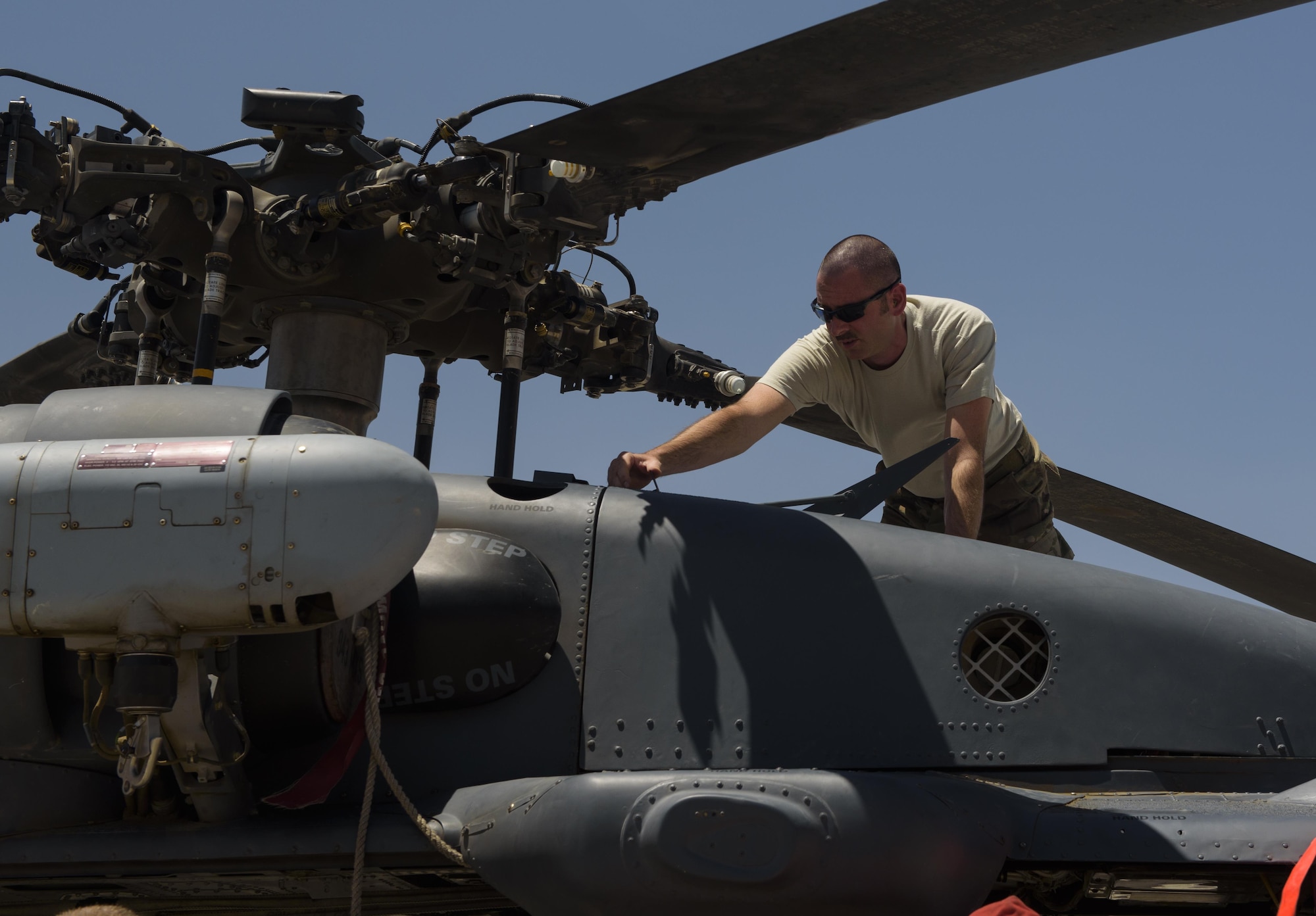 An Airman from the 83rd Expeditionary Rescue Squadron conducts routine maintenance on the HH-60G Pave Hawk on Bagram Airfield, Afghanistan, July 4, 2017. The 83rd ERQS is on-call at all times, never knowing when they might receive the call to rescue ground troops in need of urgent medical care. The maintainers and aircrew ensure the HH-60 is ready at all times for when that call does come in. (U.S. Air Force photo by Staff Sgt. Benjamin Gonsier)