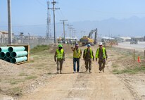 Jerry Winburn, a contractor at Bagram Airfield, Afghanistan, discusses the hazards and necessary safety precautions involved in trench work and excavation projects. Airmen from the 455th Expeditionary Civil Engineer Squadron visited the site of a new waterline, preparing themselves for possible future projects they'll encounter downrange and later in their careers. The visit coincided with Trench Safety Stand-down week, which recognizes the unqiue--and dangerous--challenges of working below ground. (U.S. Air Force photo by Capt. Keenan Kunst)