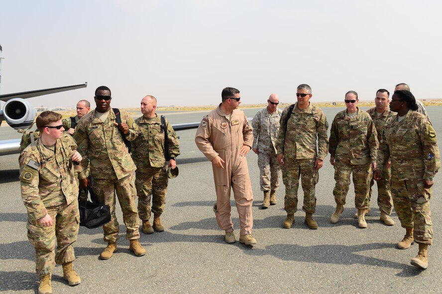 U.S. Air Force Col. John Gonzales, 407th Air Expeditionary Group commander, greets U.S. Army Lt. Gen. Stephen Townsend, Combined Joint Task Force – Operation Inherent Resolve commanding general, and staff on the flightline during a visit to the 407th AEG in Southwest Asia July 6, 2017. Townsend had an all-call where he thanked Airman, Marines and coalition personnel for the great job at executing their mission in support of OIR. (U.S. Air Force photo by Tech Sgt. Andy M. Kin)