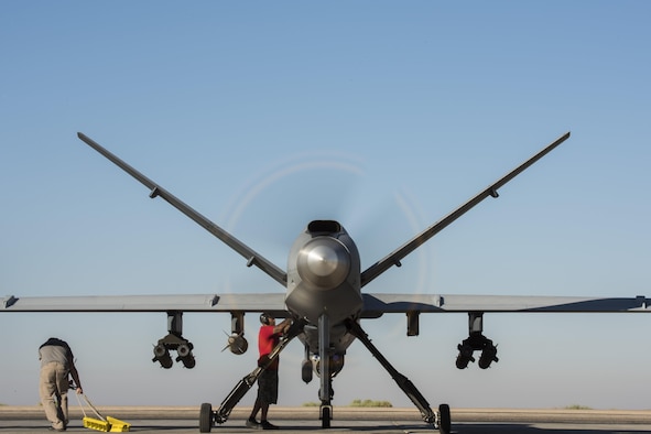 Maintainers perform final preflight procedures prior to a MQ-9 Reaper, Block 5 variant, taking off June 23, 2017, in Southwest Asia. This marked the block’s first combat flight in support of Operation Inherent Resolve. (U.S. Air Force photo/Senior Airman Damon Kasberg)