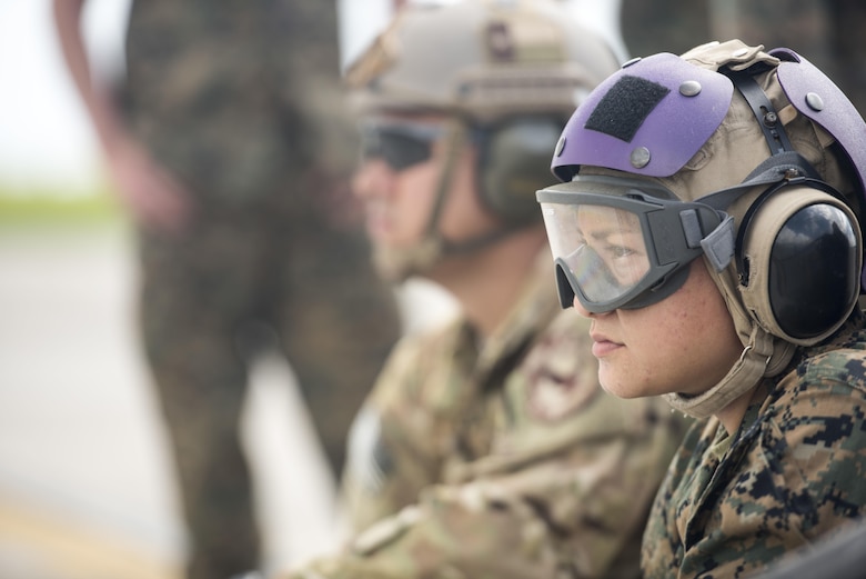 U.S. Marine Corps Cpl. Elizabeth Cruz, Marine Wing Support Squadron 172 motor transportation refueler, stands by to refuel an F-35B Lightning II during a forward area refueling point joint training exercise June 27, 2017, at Kadena Air Base, Japan. The training between services gave the Marine Corps a unique opportunity to practice joint operations with the 353rd Special Operations Group by utilizing the MC-130J Commando II and MC-130H Talon II's unique ability to air deliver 18th Logistics Squadron ground refueling operations to forward deployed locations. (U.S. Air Force photo by Senior Airman Omari Bernard)