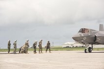 U.S. Airmen from 353rd Special Operations Group and 18th Logistics Readiness Squadron and Marine Wing Support Squadron 172refueling teams ready a fuel hose for a Marine Fighter Attack Squadron 121 F-35B Lightning II during a joint forward area refueling point training exercise June 27, 2017, at Kadena Air Base, Japan. The training between services gave the Marine Corps a unique opportunity to practice joint operations with the 353rd Special Operations Group by utilizing the MC-130J Commando II and MC-130H Talon II's unique ability to air deliver 18th Logistics Squadron ground refueling operations to forward deployed locations. (U.S. Air Force photo by Senior Airman Omari Bernard)