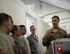 U.S. Air Force Staff Sgt. Brent Points, a journeyman with the 379th Expeditionary Civil Engineer Squadron Explosive Ordnance Disposal Flight, right, talks to airmen with the 8th Expeditionary Air Mobility Squadron on what to look for while screening luggage at Al Udeid Air Base, Qatar, June 14, 2017. The airmen are enhancing their knowledge on safety precautions for inspection of personnel luggage as they go through the passenger terminal. (U.S. Air Force photo by Tech. Sgt. Amy M. Lovgren)