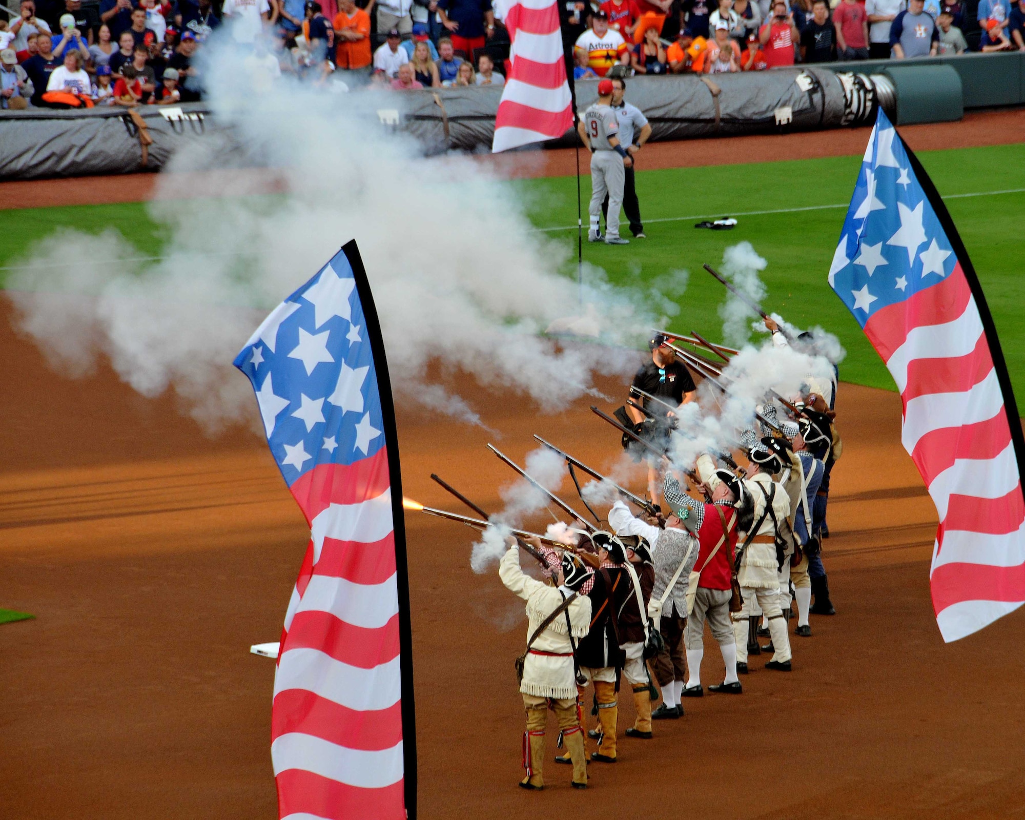 Members of the Georgia Society Sons of the American Revolution Elijah Clark Militia line up to perform a 13 gun salute during the opening ceremony of the Atlanta Braves game at SunTrust Park in Atlanta, Georgia on July 4, 2017. In addition to the salute, a group of about 80 men and women from the Army, Georgia National Guard, Air National Guard and Air Force Reserve unfurled an American Flag in the shape of the United Stated and carried it across the field during the ceremony. (U.S. Air Force photo by Staff Sgt. Jaimi L. Upthegrove)