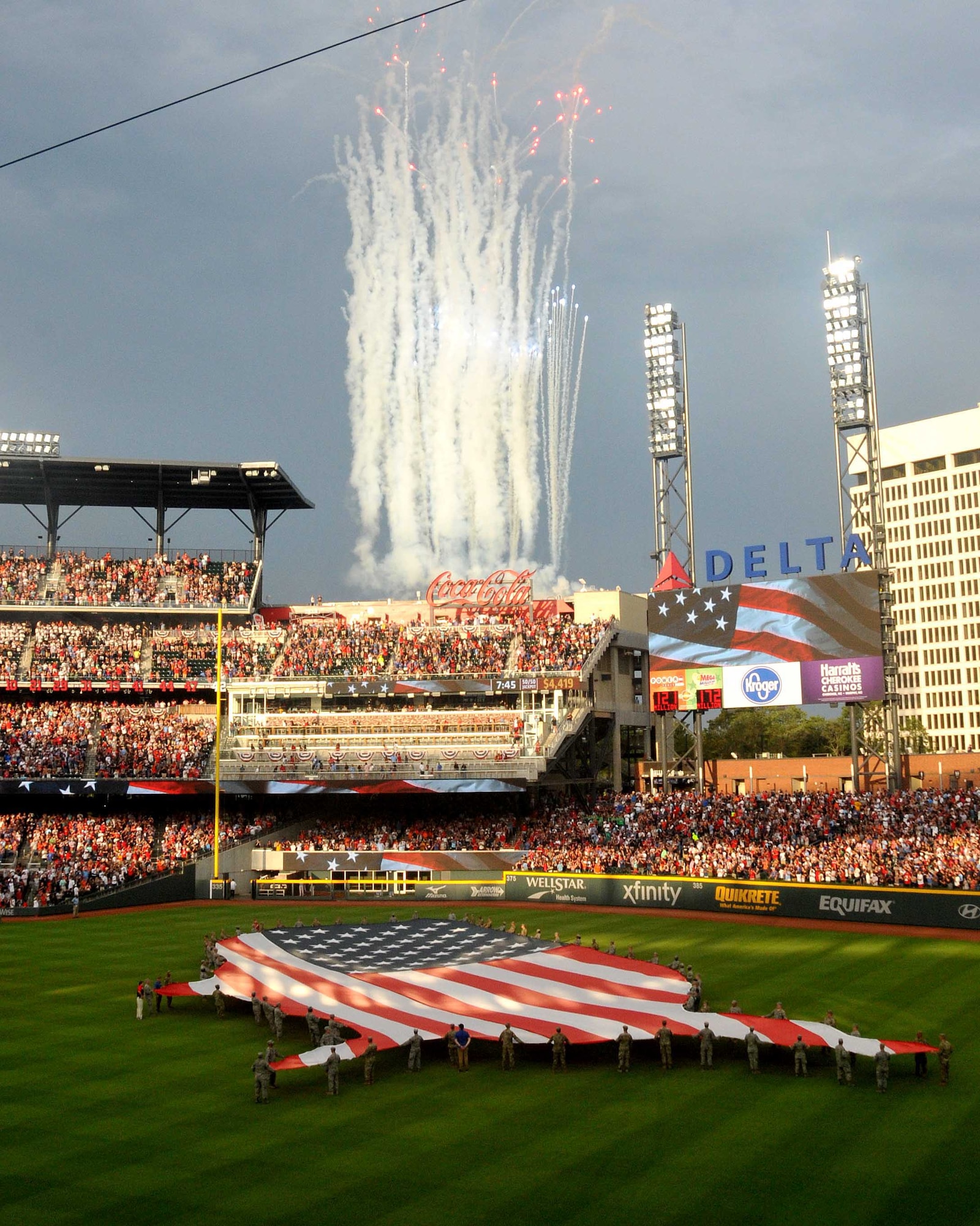 A fireworks display goes off at SunTrust Park during the opening ceremony of the Atlanta Braves game on July 4, 2017. A group of about 80 men and women from the Army, Georgia National Guard, Air National Guard and Air Force Reserve volunteered to help unfurl the flag. (U.S. Air Force photo by Staff Sgt. Jaimi L. Upthegrove)