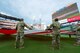 A group of about 80 military men and women in uniform unfurl an enormous American Flag, carry it onto the field, hold and wave it during the opening ceremony events at the Atlanta Braves game July 4, at SunTrust Park in Atlanta, Georgia. The group was comprised of local members from the Army, Georgia National Guard, Air National Guard and Air Force Reserve. (Courtesy photo by Patrick Duffy/Beam Imagination/Atlanta Braves/Getty Images)