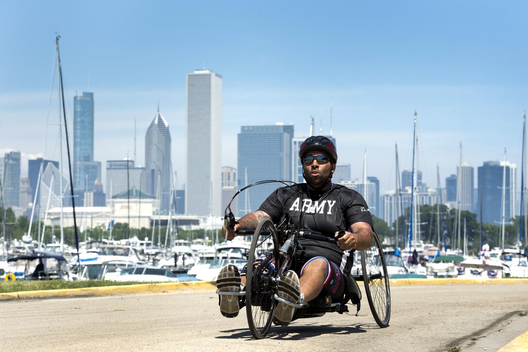 Army Sgt. Christopher McGinnis powers a hand cycle during the 2017 Department of Defense Warrior Games in Chicago, July 6, 2017. The Warrior Games are an annual event allowing wounded, ill and injured service members and veterans to compete in Paralympic-style sports. DoD photo by EJ Hersom