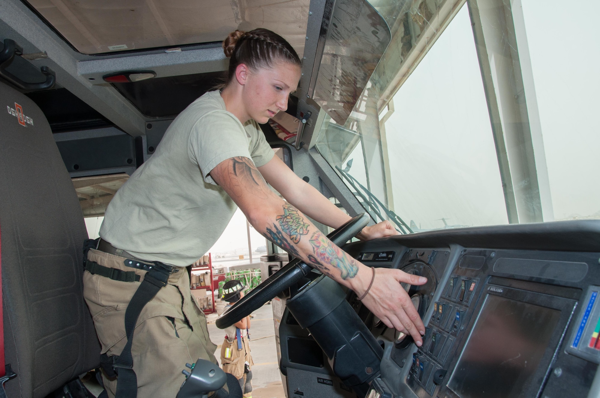 Senior Airman Ashley Eisenbarth, a firefighter assigned to the 386th Civil Engineer Squadron, increases the pump throttle on a fire truck at an undisclosed location in Southwest Asia, June 25, 2017. (U.S. Air Force photo by Master Sgt. Eric M. Sharman)