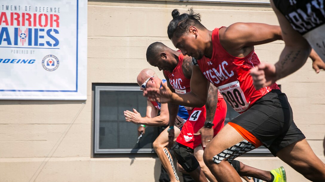 U.S. Marine Corps veteran Leon Pierce, left, races alongside U.S. Marine Corps veteran Guillermo Lopez, right, during the 2017 DoD Warrior Games Track Competition at Lane Technical College Preparatory High School in Chicago July 2, 2017. Pierce, a native of Northridge, Calif., and Guillermo a native of San Antonio, Texas, are a members of Team Marine Corps. The DoD Warrior Games is an adaptive sports competition for wounded, ill and injured service members and veterans.