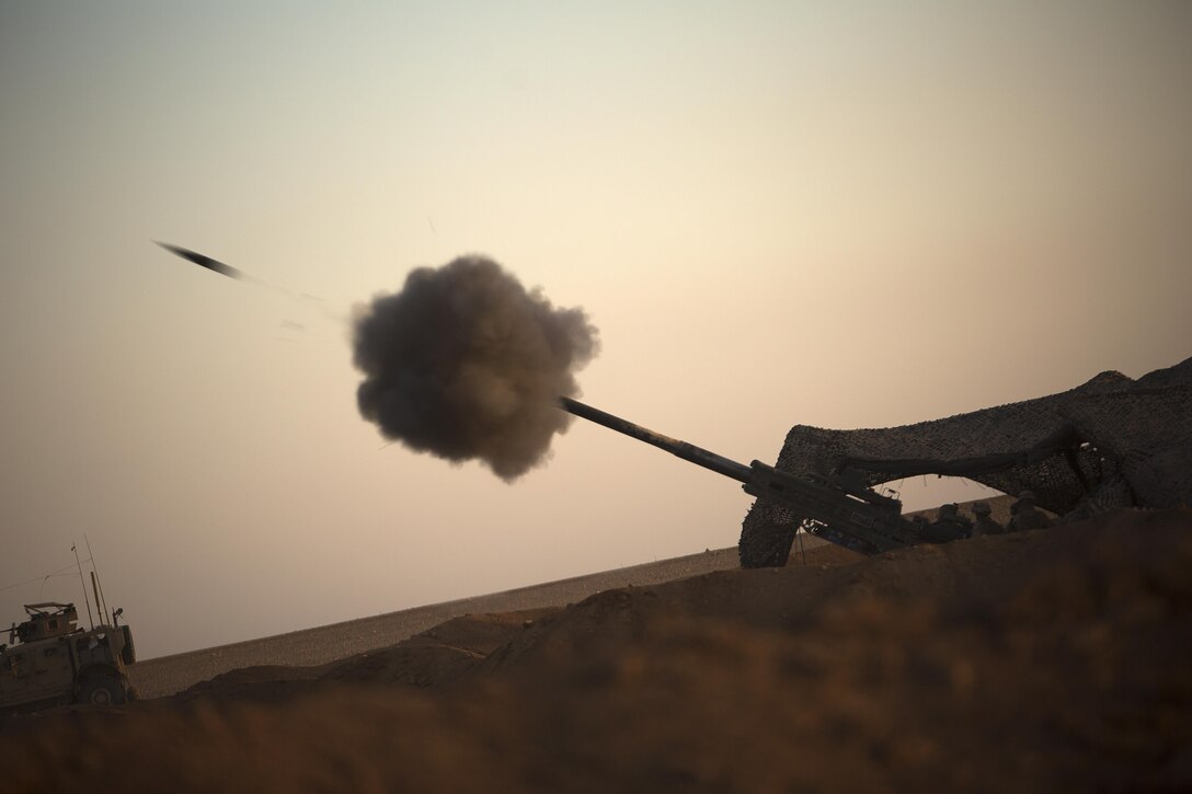 UNDISCLOSED LOCATION, SYRIA (May 15, 2017)— U.S. Marines fire an M777-A2 Howitzer in northern Syria, May 15, 2017. They have been conducting 24-hour all-weather fire support for the Coalition’s local partners, the Syrian Democratic Forces, as part of Combined Joint Task Force-Operation Inherent Resolve. CJTF-OIR is the global coalition to defeat ISIS in Iraq and Syria. (U.S. Marine Corps photo by Sgt. Matthew Callahan)