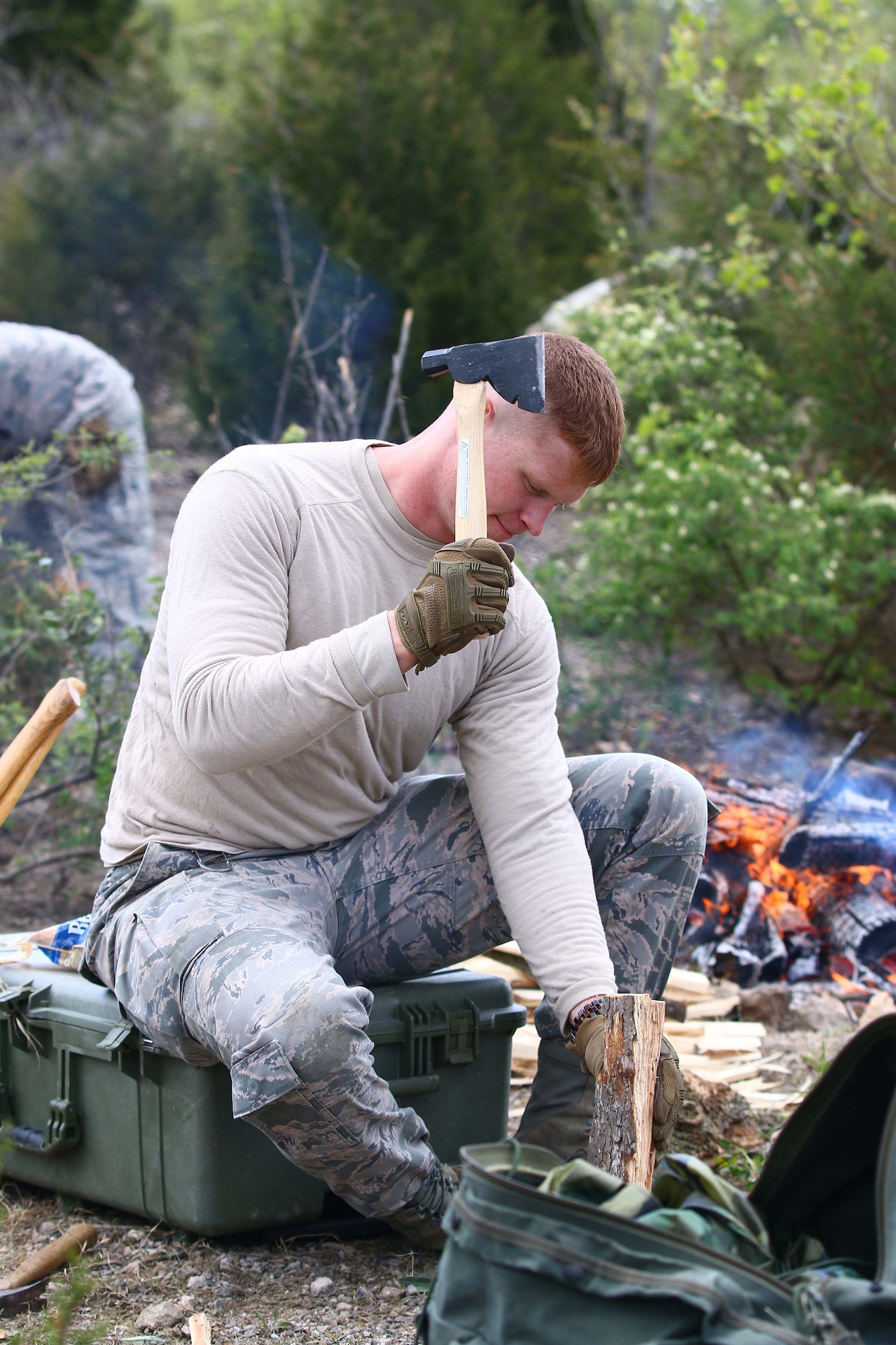 Staff Sgt. Shayne Denihan, 445th Security Forces Squadron, chops wood for preparation for fire-building training during the SERE training at the Oakes Quarry Park, Fairborn, Ohio May 6, 2017. This was part of a three-day expeditionary training which consisted of several phases to include: Humvee mount/dismount, SERE, setting up/tear down tents, and night vision goggles. (U.S. Air Force photo /Tech. Sgt. Patrick O’Reilly)