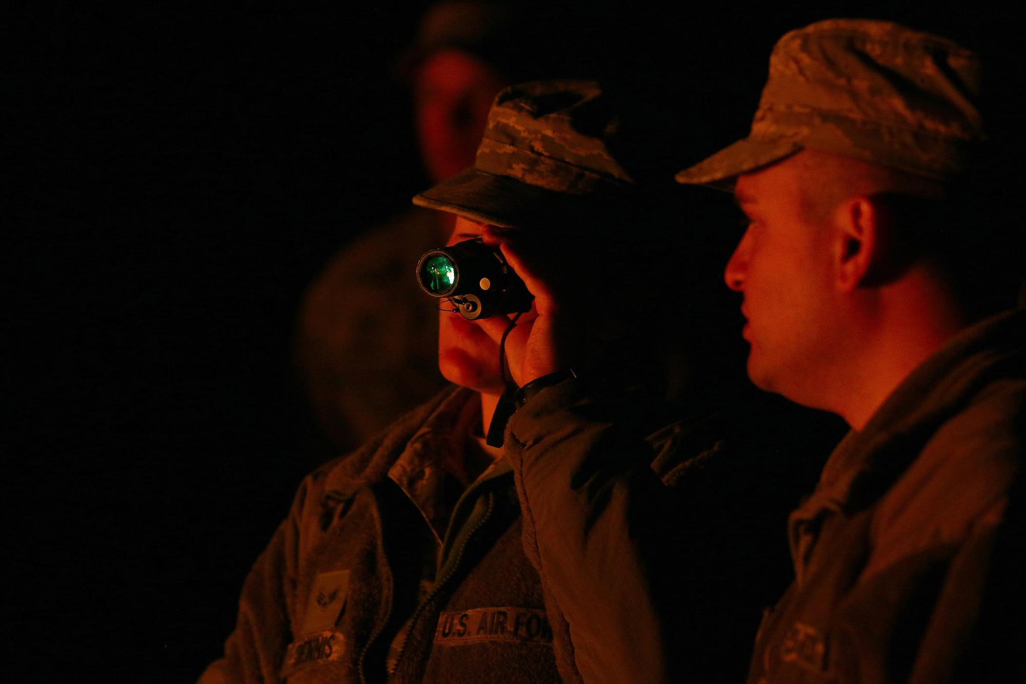 Senior Airman Paula Dennis (left) and Senior Airman Tyler Acevedo, both assigned to the 445th Security Forces Squadron, test out night vision goggles during training at the Oakes Quarry Park, Fairborn, Ohio May 6, 2017. The three-day expeditionary training consisted of several phases to include: Humvee mount/dismount, SERE, setting up/tear down tents, and night vision goggles. (U.S. Air Force photo /Tech. Sgt. Patrick O’Reilly)