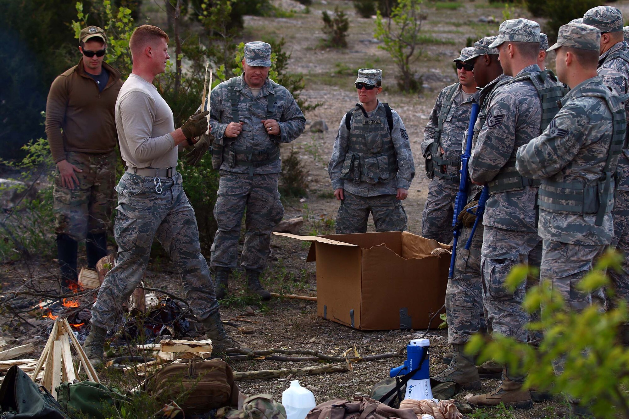 Staff Sgt. Shayne Denihan, 445th Security Forces Squadron, trains SFS Airmen on how to build a fire in an austere environment during the SERE training at the Oakes Quarry Park in Fairborn, Ohio May 6, 2017. This event was part of a three-day expeditionary training which consisted of several phases to include: Humvee mount/dismount, SERE, setting up/tear down tents, and night vision goggles. (U.S. Air Force photo /Tech. Sgt. Patrick O’Reilly)