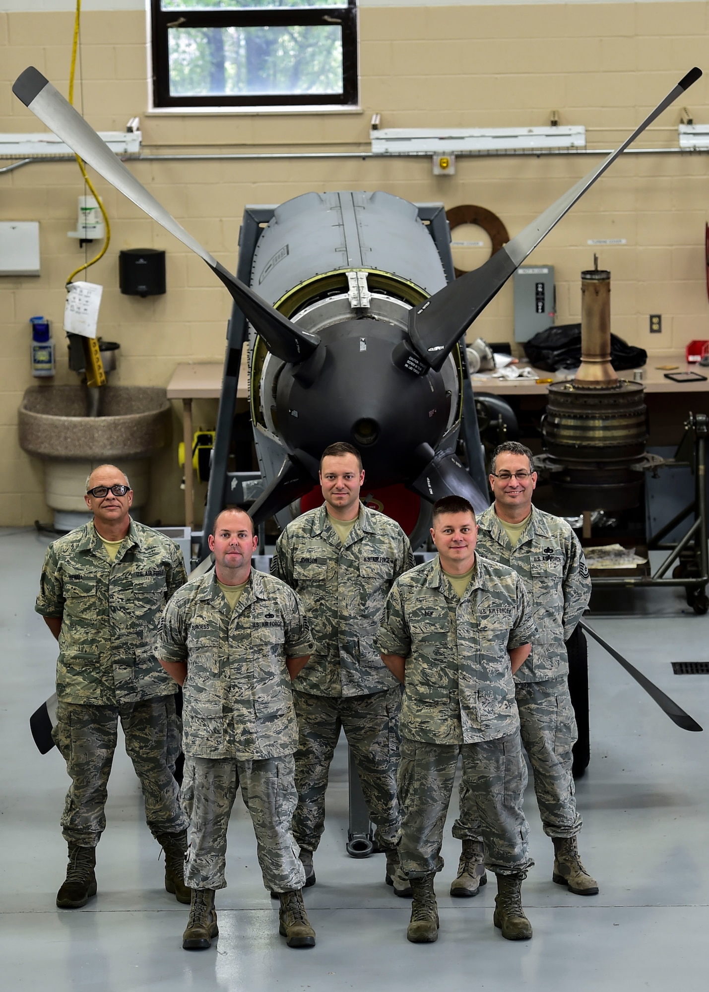 Citizen Airmen from the 910th Maintenance Squadron’s propulsion shop here, pose for a photo in front of an Allison T56-A-15 turboprop engine here, July 6, 2017. (From Left) Master Sgt. Ben Sewall, Tech. Sgt. Jeff Burgess, Master Sgt. James Johnson, Tech. Sgt. Steve Lew and Senior Master Sgt. Bob Pierce are pictured. (U.S. Air Force Photo/Senior Airman Jeffrey Grossi)
