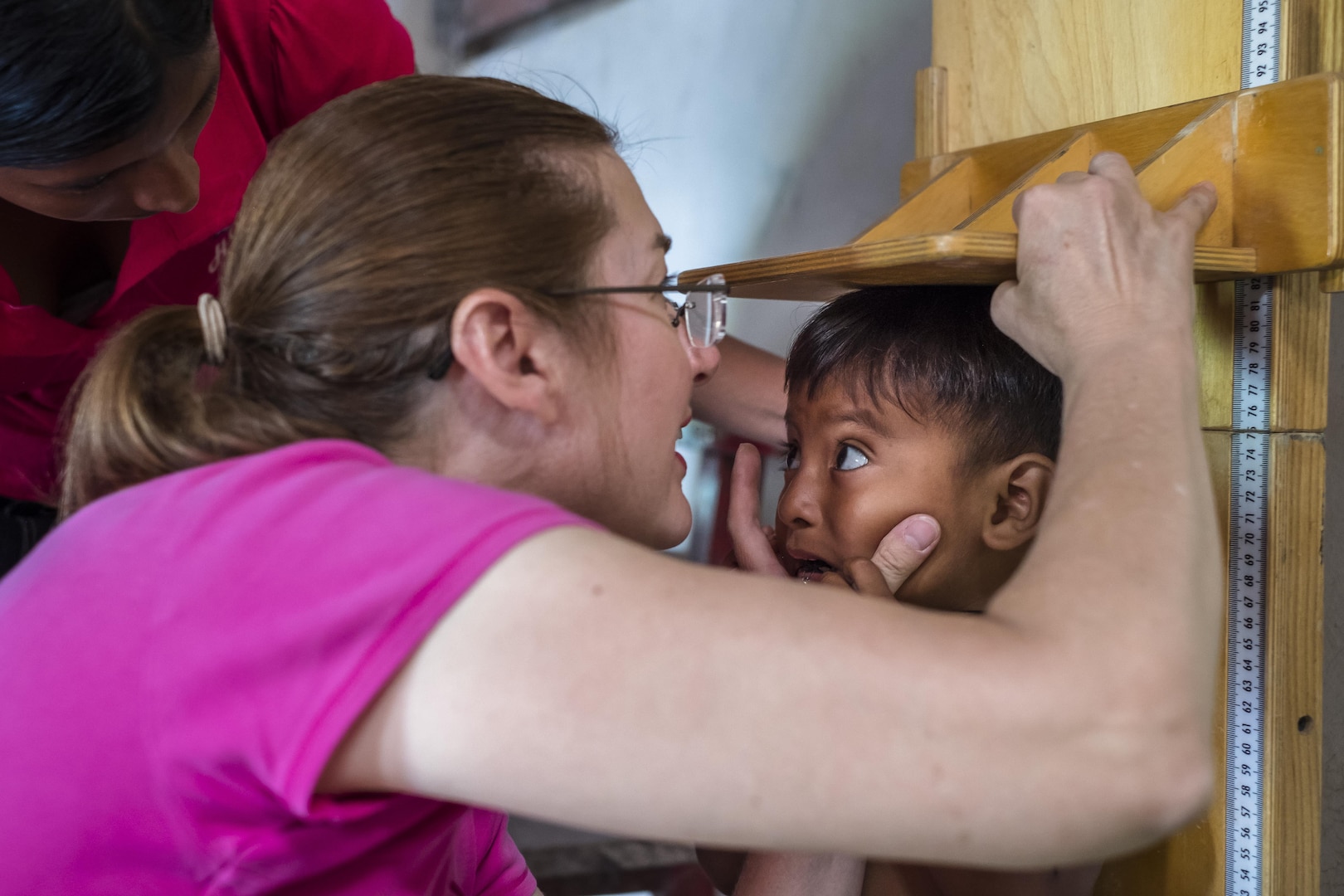 U.S. Army LTC Rhonda Dyer performs anthropometric measurements on a child during a pediatric nutritional assessment mission. Joint Task Force – Bravo Medical Element personnel participated in a pediatric nutritional assessment mission as members of a joint team with the Honduran Ministry of Health to assess the nutritional status of children from the ages of 6 months to 60 months in the San Antonio area of La Paz, Honduras, Jun 14 - 15, 2017. 