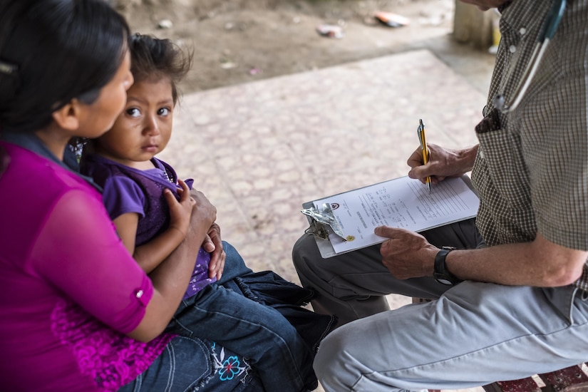 U.S. Army Col. Douglas Lougee performs a physical assessment on a child during a pediatric nutritional assessment mission. Joint Task Force – Bravo Medical Element personnel participated in a pediatric nutritional assessment mission as members of a joint team with the Honduran Ministry of Health to assess the nutritional status of children from the ages of 6 months to 60 months in the San Antonio area of La Paz, Honduras, Jun 14 - 15, 2017. 