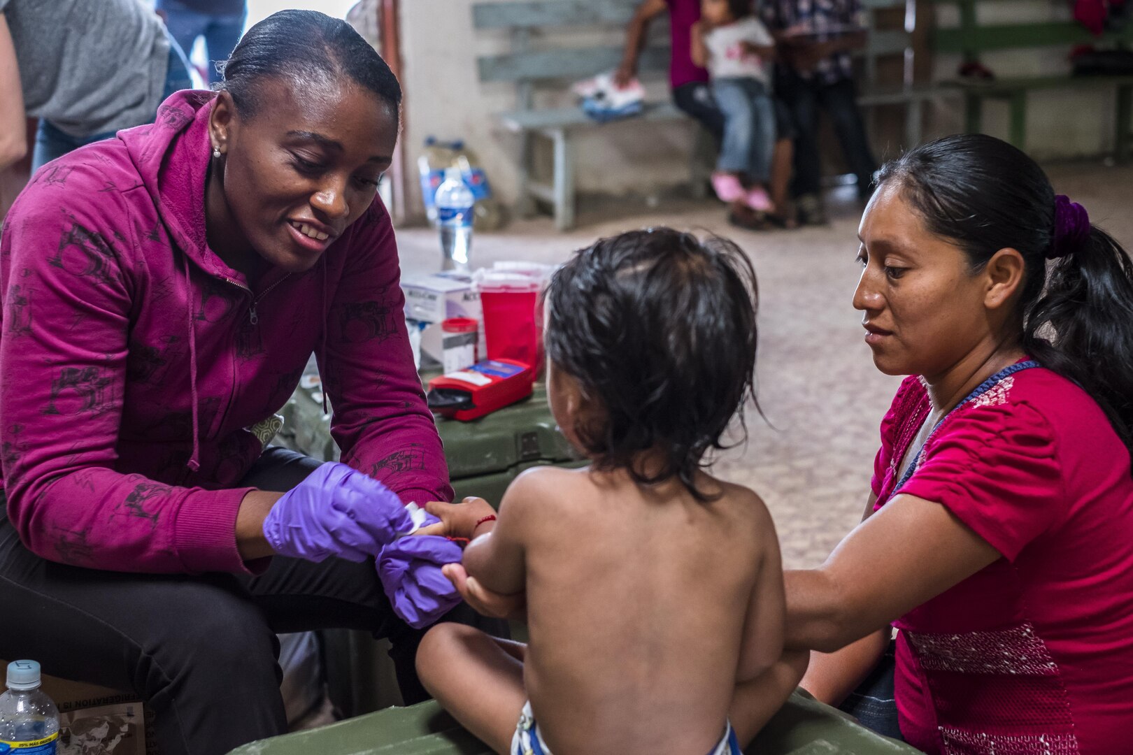 U.S. Army 1LT Evelyn Nguedia performs hemoglobin test to determine the values on a child during a pediatric nutritional assessment mission. Joint Task Force – Bravo Medical Element personnel participated in a pediatric nutritional assessment mission as members of a joint team with the Honduran Ministry of Health to assess the nutritional status of children from the ages of 6 months to 60 months in the San Antonio area of La Paz, Honduras, Jun 14 - 15, 2017. 