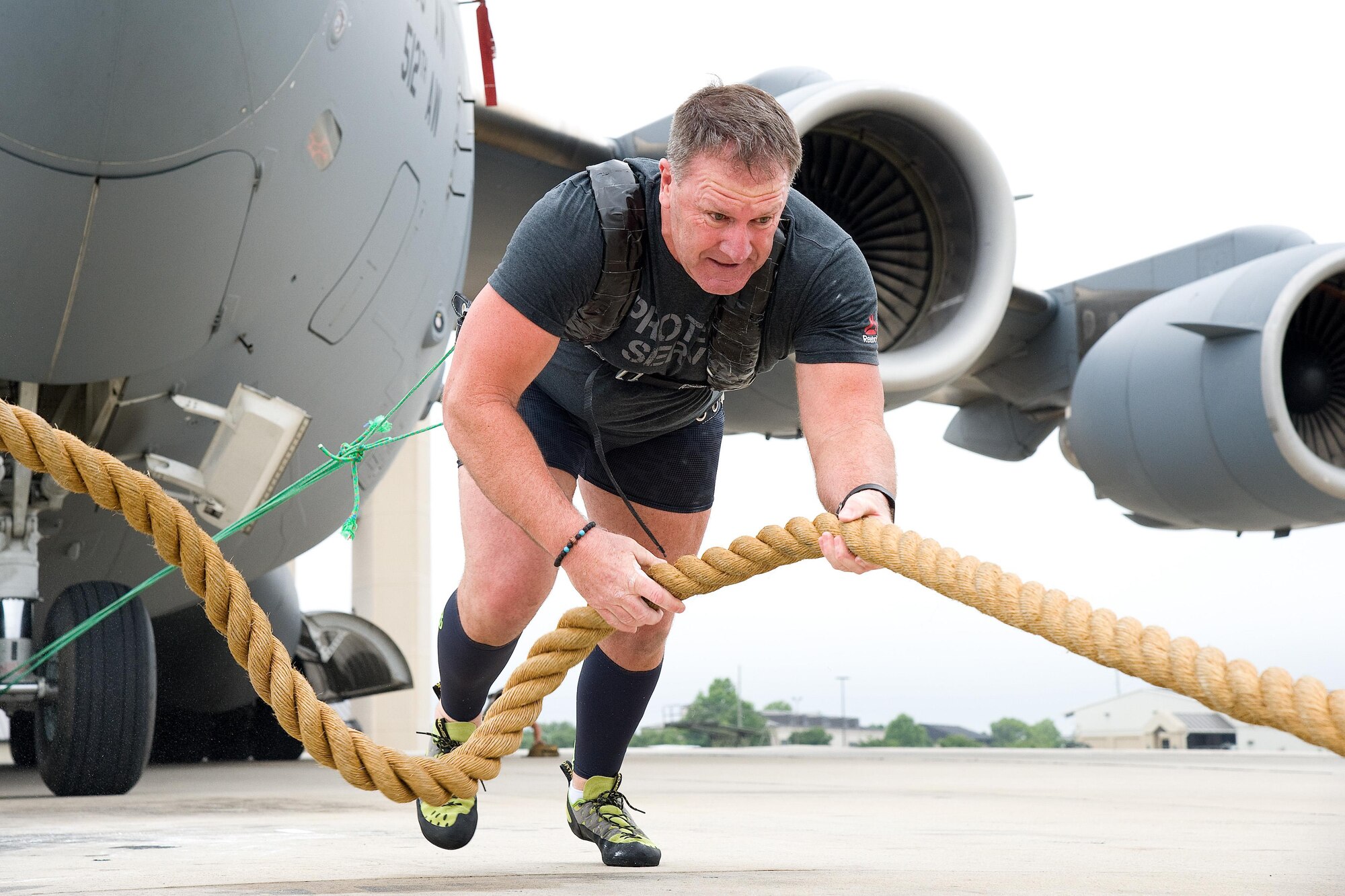 Cmdr. Grant Edwards, Australian Federal Police, Embassy of Australia, Washington, D.C., slowly pulls a C-17 Globemaster III on his first attempt, June 16, 2017, on Dover Air Force Base, Del. Edwards, an Australian strongman athlete, who has previously competed in the World’s Strongest Man competition, is scheduled to attempt pulling a C-17 during the “Thunder Over Dover: 2017 Dover AFB Open House,” Aug. 26-27. (U.S. Air Force photo by Roland Balik)