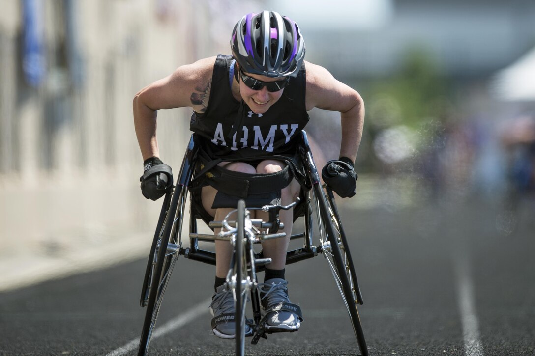 U.S. Army Reserve Staff Sgt. Rachel Salemink races a wheel chair during the 2017 Department of Defense Warrior Games at Lane Technical College Preparatory High School in Chicago July 2, 2017. The DoD Warrior Games are an annual event allowing wounded, ill and injured service members and veterans to compete in Paralympic-style sports. (DoD photo by EJ Hersom)