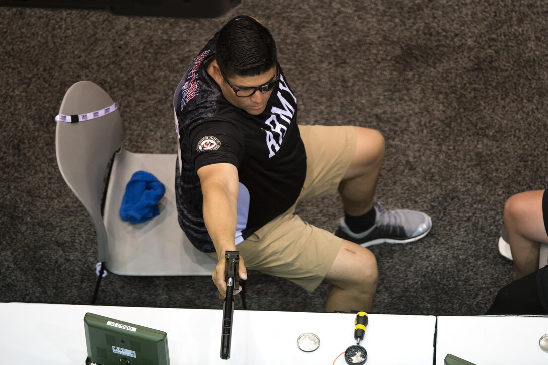 U.S. Army Reserve Staff Sgt. Marcus Menchaca competes in pistol shooting during the 2017 Dept. of Defense Warrior Games in Chicago July 6, 2017. The DoD Warrior Games are an annual event allowing wounded, ill and injured service members and veterans to compete in Paralympic-style sports. (DoD photo by EJ Hersom)