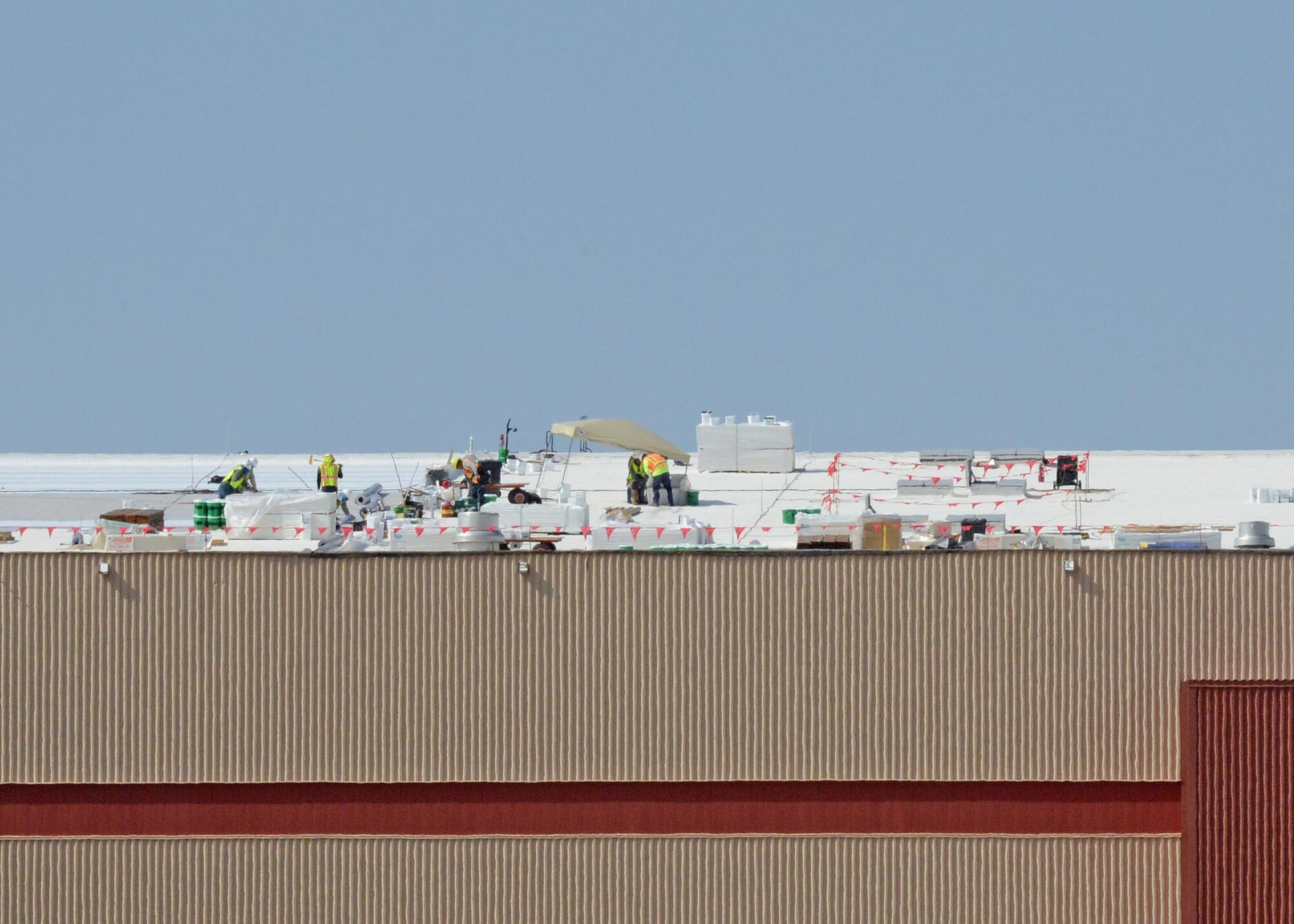 The 412th Civil Engineer Group is overseeing a roof upgrade for the Benefield Anechoic Facility. The project should last 45-50 days depending on heat and weather conditions. (U.S. Air Force photo by Kenji Thuloweit)