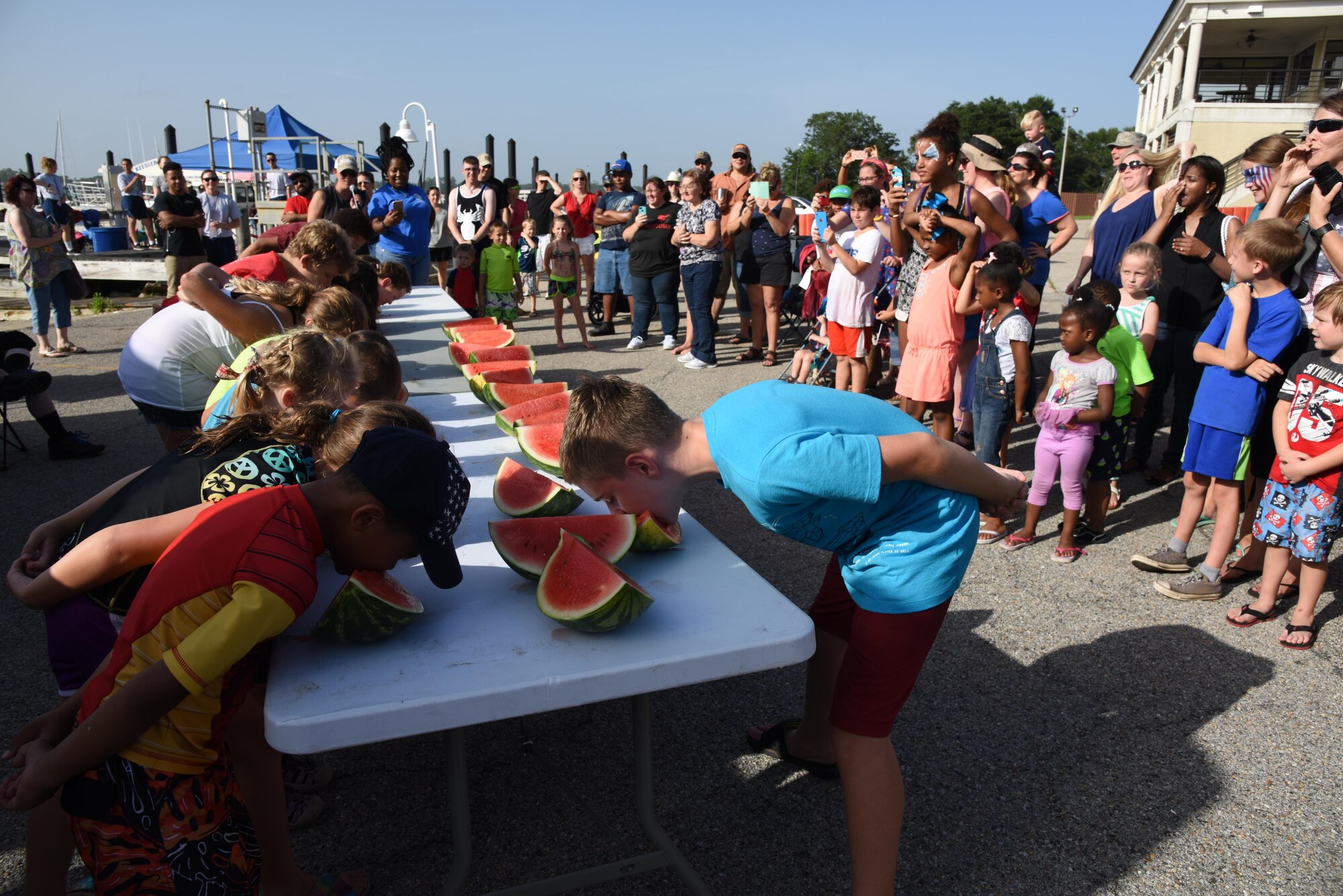 Keesler children participate in the watermelon eating competition during the Pops in the Park event at Marina Park July 1, 2017, on Keesler Air Force Base, Miss. The event also included a kids’ fishing rodeo, mullet toss, fireworks display and music performances. (U.S. Air Force photo by Kemberly Groue)