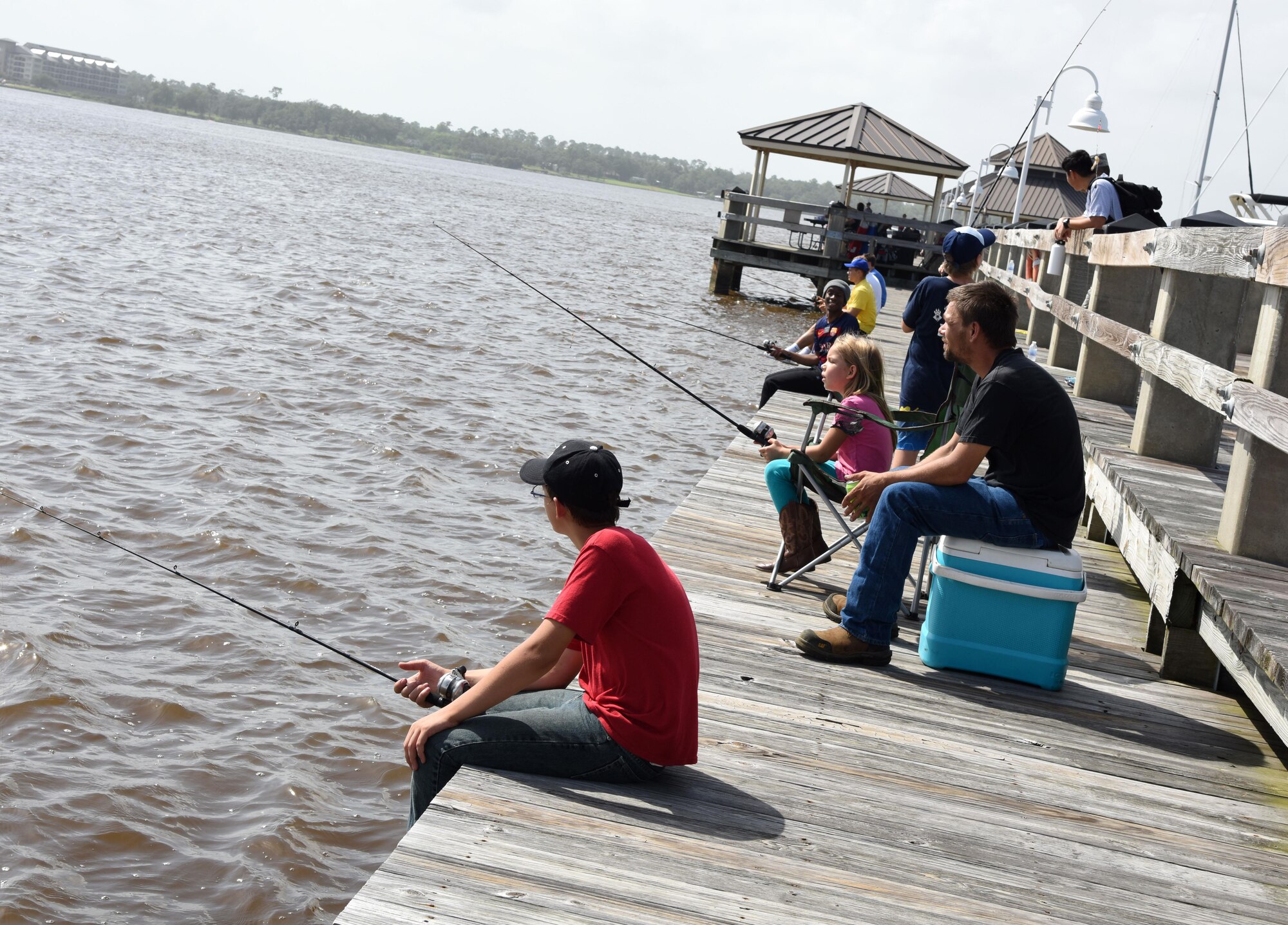 Keesler families participate in the kids’ fishing rodeo during the Pops in the Park event at Marina Park July 1, 2017, on Keesler Air Force Base, Miss. The event also included a mullet toss, fireworks display and music performances. (U.S. Air Force photo by Kemberly Groue)

