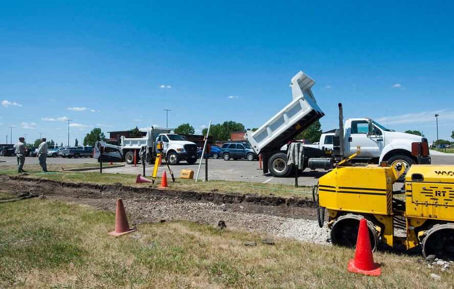 Members of the 5th Civil Engineer Squadron build a sidewalk at Minot Air Force Base, N.D., May 17, 2017. Due to various cracks in the sidewalks, the 5 CES “Dirt Boys” were tasked to remodel, which will provide easier and safer access to base facilities year-round. (U.S. Air Force photo by Airman 1st Class Jonathan McElderry)