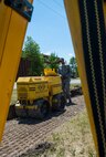 Airman 1st Class Harold McIntyre, 5th Civil Engineer Squadron pavements and equipment technician, uses a soil compactor to flatten the ground at Minot Air Force Base, N.D., June 12, 2017. Due to harsh weather and attrition on the sidewalks, the CES “Dirt Boys” were tasked to rebuild them, a process that takes several hours to complete. (U.S. Air Force photo by Airman 1st Class Jonathan McElderry)