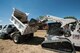 Airman 1st Class Harold McIntyre, 5th Civil Engineer Squadron pavements and equipment technician, uses a Bobcat T300 to remove dirt from a dump truck at Minot Air Force Base, N.D., June 12, 2017. The 5 CES Airmen are trained on a variety of heavy and light-duty equipment. (U.S. Air Force photo by Airman 1st Class Jonathan McElderry)