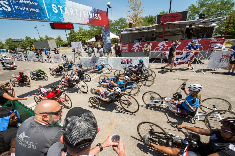 Athletes ride past Adler Planetarium during the cycling competition for the 2017 Department of Defense Warrior Games in Chicago, Ill., July 6, 2017. The games are an annual event allowing wounded, ill and injured service members and veterans to compete in paralympic-style sports. DoD photo by Roger L. Wollenberg